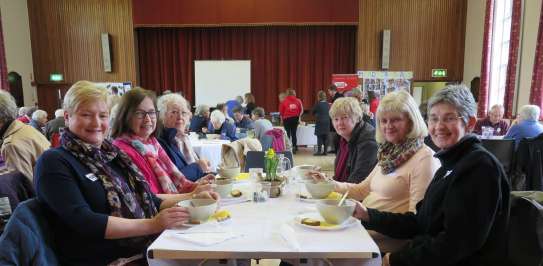 Ladies enjoying lunch at a Christian Aid Lunch event.