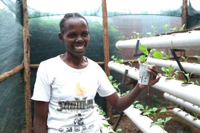 Woman in hydroponic garden