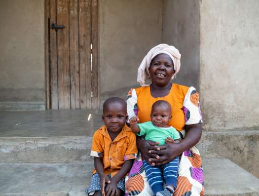 Esther embracing grandchildren in Malawi