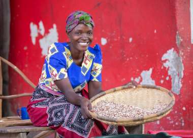 Janet Ben, 31, proudly showing the beans that she sells at the market