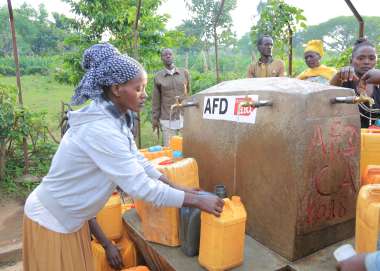 A woman in Ethiopia collecting water at a water point constructed by Christian Aid