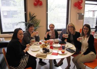 Christian Aid supporters enjoying a coffee at a Coffee for Christian Aid event. 